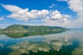 White clouds blue sky beautiful lake with wonderful mirror reflecion Royalty Free Stock Photo