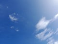 White clouds in the blue sky. Heaven and infinity. Beautiful bright blue background. Light cloudy, good weather. Royalty Free Stock Photo