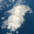 White clouds in the blue sky. Isolated view from airplane window Royalty Free Stock Photo