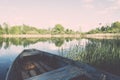 White clouds on the blue sky over blue lake with boats and board Royalty Free Stock Photo