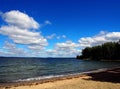 White clouds in the blue sky over the lake in the early morning Royalty Free Stock Photo