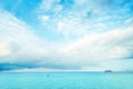 White clouds in the blue sky over the ocean Royalty Free Stock Photo