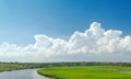 white clouds in blue sky over river Royalty Free Stock Photo