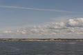 White clouds in the blue sky in Skagerrak Strait near StrÃÂ¶mstad between Sweden and Norway on a sunny day with navy blue sea