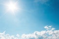 White Clouds on the blue sky with sun shines Royalty Free Stock Photo
