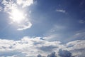 White Clouds on the blue sky with sun shines Royalty Free Stock Photo