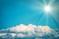 White clouds and bright sun on the blue sky Royalty Free Stock Photo