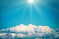 White clouds and bright sun on the blue sky Royalty Free Stock Photo