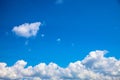 White clouds chain below blue sky. Sunny cloudscape photo background. Skyscape with fluffy cloud Royalty Free Stock Photo