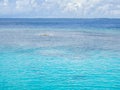 White clouds and clear blue sea background