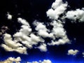 The white clouds in dark bright blue sky. Beatifull background.