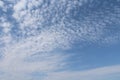 White clouds daytime on a blue sky closeup as a background.