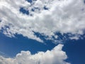 White clouds disappear in the hot sun on blue sky. Clouds on blue sky background. Weather nature blue sky with white cloud and sun Royalty Free Stock Photo