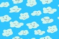 White clouds with funny faces against the blue sky. Vector illustration Seamless pattern Wallpaper background Royalty Free Stock Photo