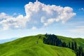 The white clouds upon the mountains in summer grassland Royalty Free Stock Photo