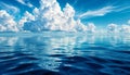 White clouds over blue sea. Clouds are reflected in the water Royalty Free Stock Photo