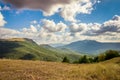 White clouds over wonderful hills and valley Royalty Free Stock Photo