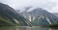 The plateau scenery of white clouds and high mountains