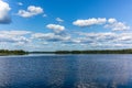 White clouds reflecting on the calm waters of the Saimaa lake in the Linnansaari National Park in Finland - 2 Royalty Free Stock Photo