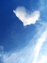 White clouds in the sky with heart-shaped against the blue sky background Royalty Free Stock Photo