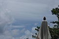 White cloudy blue sky background with the white vintage parasol. Royalty Free Stock Photo