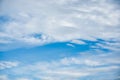 White cloudy forming on blue sky in sunny day