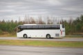 White Coach Bus on Motorway on a Cloudy Day