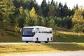 White Coach Bus Travel in Autumn Royalty Free Stock Photo