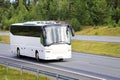 White Coach Bus Traveling on Motorway