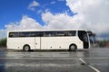 White Coach Bus Waits for Passengers on Foggy Rainy Morning Royalty Free Stock Photo