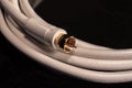 White Coax cable for satelite cable video audio connections Royalty Free Stock Photo