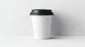 Clean white paper coffee cup with black lid mockup on light background, takeaway beverage container Royalty Free Stock Photo