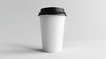 A white coffee cup with black lid on a table Royalty Free Stock Photo