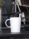 White coffee cup on the black table. 3d rendering Royalty Free Stock Photo