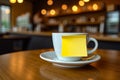White Coffee Cup with Blank Yellow Sticky Note on Wooden Table in Cozy Cafe Royalty Free Stock Photo