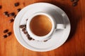 White coffee Cup with delicious foam, close-up top view on wooden background. Concept of coffee break and serving coffee Royalty Free Stock Photo