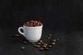 White Coffee Cup Filled with Coffee Beans Royalty Free Stock Photo