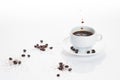 White coffee cup with flying drops, .with coffee beans isolated  on white background with copy space Royalty Free Stock Photo