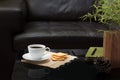 White coffee cup on glass table in living room