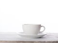 White coffee cup on grune wooden background
