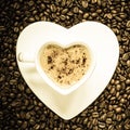 White coffee cup heart shaped with cappucino Royalty Free Stock Photo