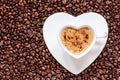 White coffee cup heart shaped with cappucino Royalty Free Stock Photo