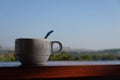 White coffee cup in morning with mountain view, thailand Royalty Free Stock Photo