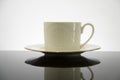White coffee cup with plate on black table Royalty Free Stock Photo