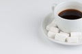 White coffee cup with sugar cubes isolated on white background Royalty Free Stock Photo