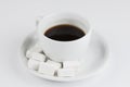 White coffee cup with sugar cubes isolated on white background Royalty Free Stock Photo