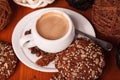 White coffee Cup with thick milk foam and cookies, closeup on a wooden table. Concept of coffee break and serving coffee Royalty Free Stock Photo