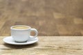 White coffee cup on oak wooden table. Copy space Royalty Free Stock Photo