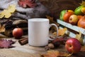 White coffee mug mockup with fall leaves and knitted plaid