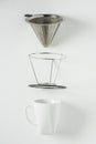 White coffee mug on white background. Metal pour over drip cone pulled apart Royalty Free Stock Photo